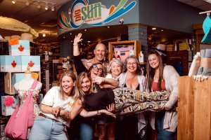 Three decades strong – the Big Sun Beachwear team is all smiles for 30 years of helping you feel confident in your suit.